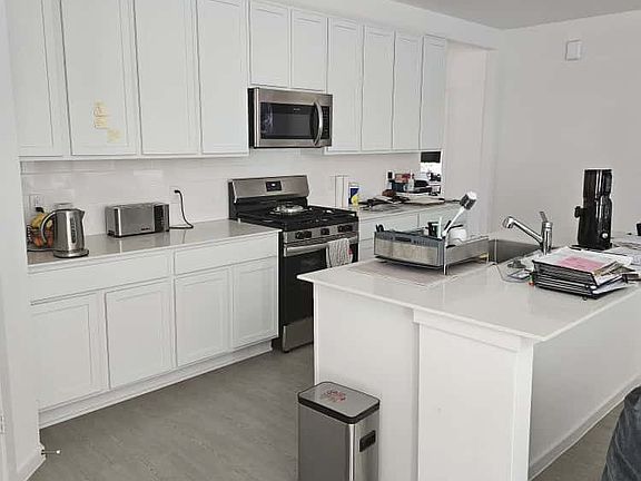 Open kitchen with stainless steel appliances