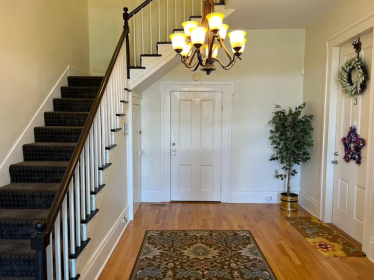 Foyer with stair access to upstairs apartment.
