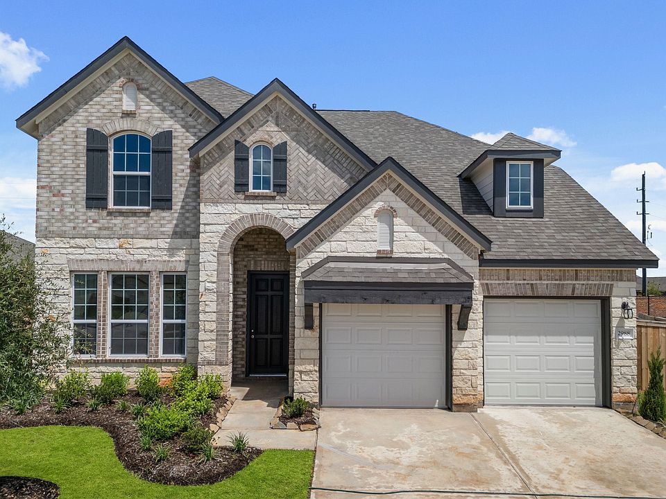 Welcome home to 2988 Golden Dust Drive located in the Sunterra community and zoned to Katy ISD.