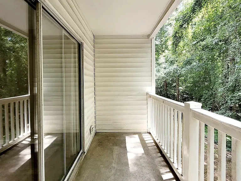 Balcony + Wooded View