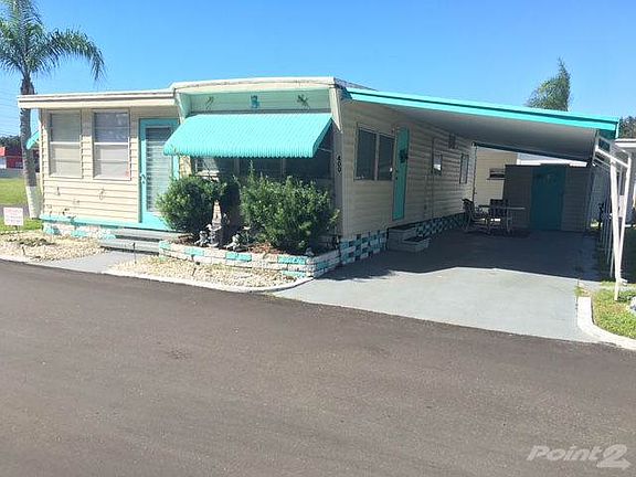 Front of home with carport