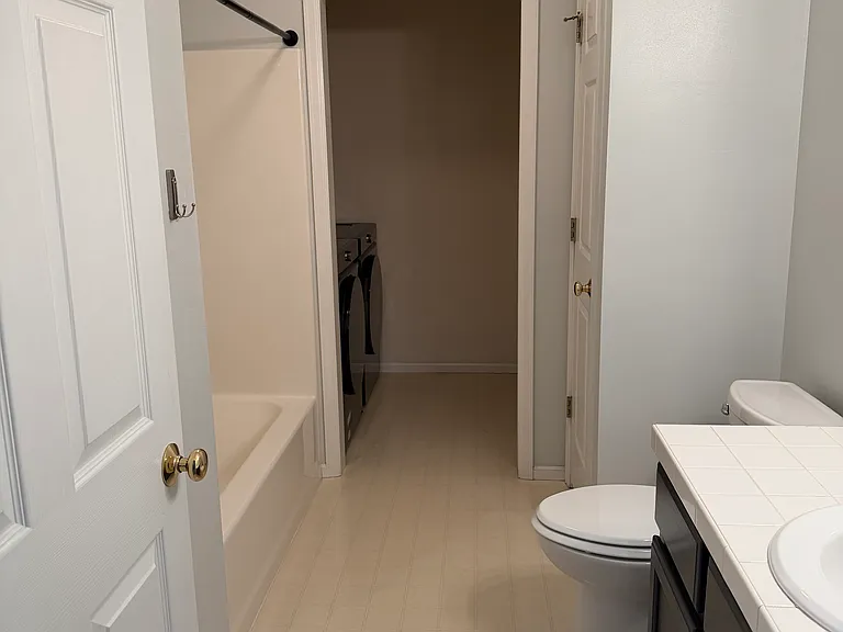 Second bathroom with laundry room.