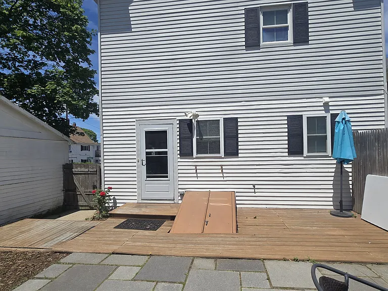 Rear entrance with gate on the left.