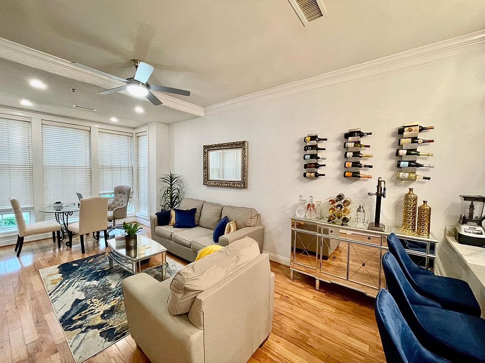Living Room w/ Designer Ceiling Fan and 9' Ceilings.