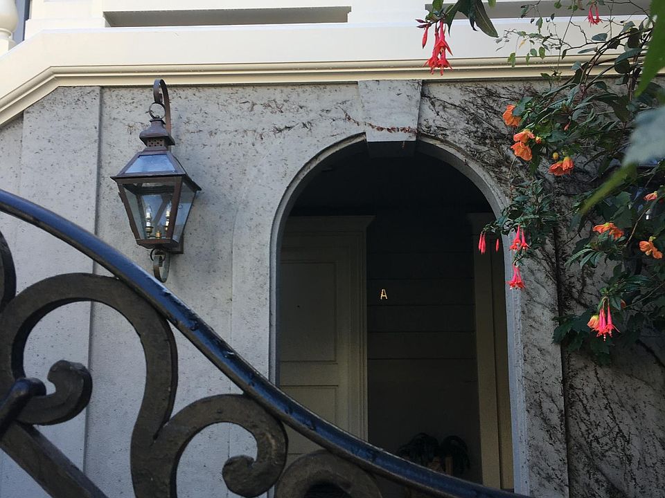 Front of property; rental unit through arch