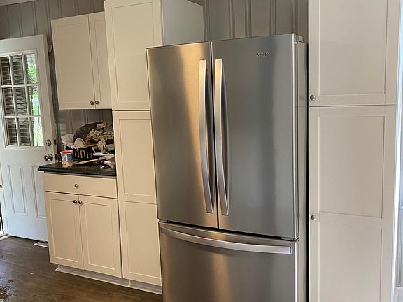 You can either enter the house by the side door which is under car port enters kitchen or the door in the front into the living room