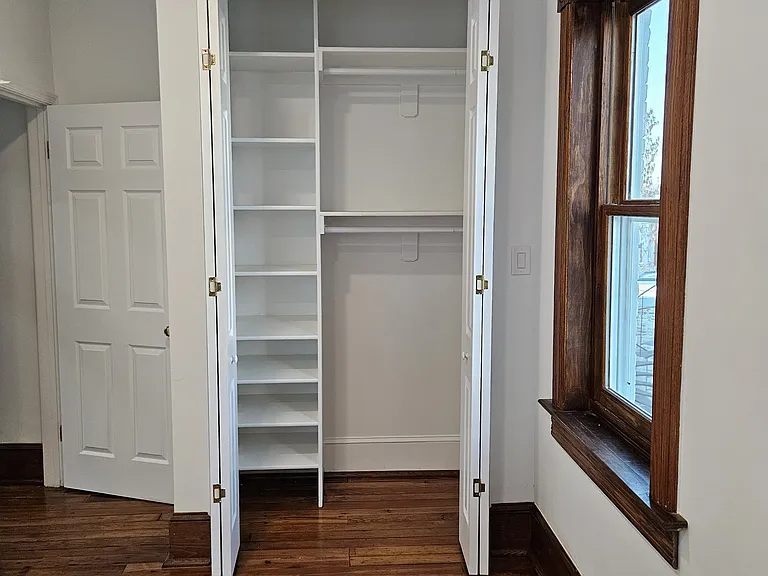 3d floor: rear bedroom 8 feet closet with multiple racks an shelves.