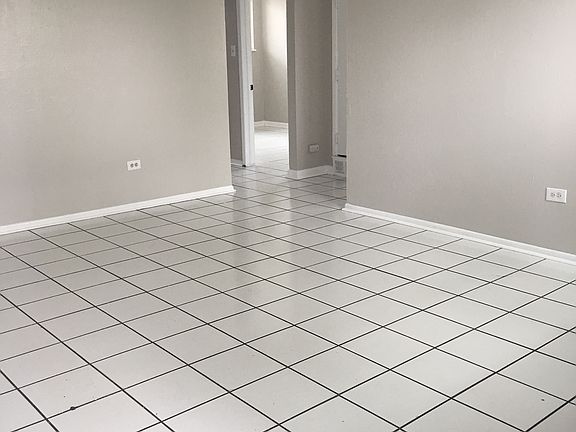 spacious living room with tile floors