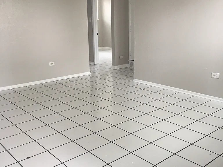 spacious living room with tile floors