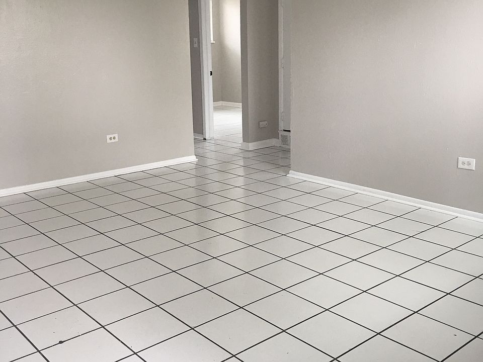 spacious living room with tile floors