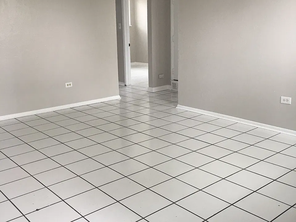 spacious living room with tile floors