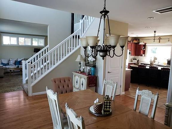 Stairway, formal dining room and kitchen