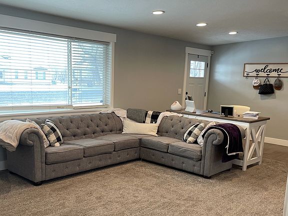 Spacious living area, with entryway. *Paint color has been updated since this photo.