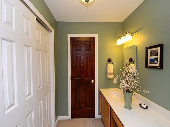 Dressing area in the master suite with ample closets and sink