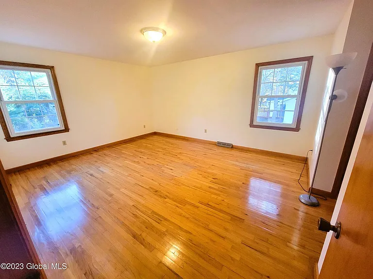 Bedroom 1 (primary) with HW floors