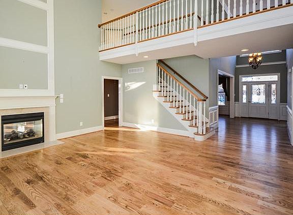 Living room is open to foyer and balcony