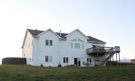 Back of house with walkout