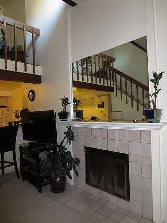 Living room with wood-burning fire-place.