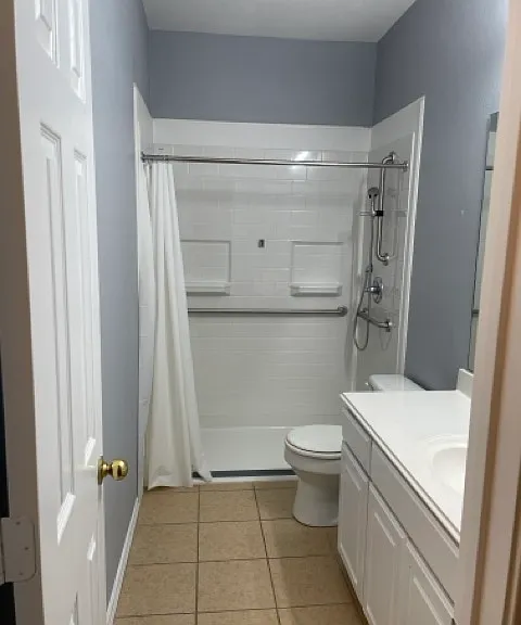 Downstairs bathroom with roll in shower w/handles....ADA compliant.
