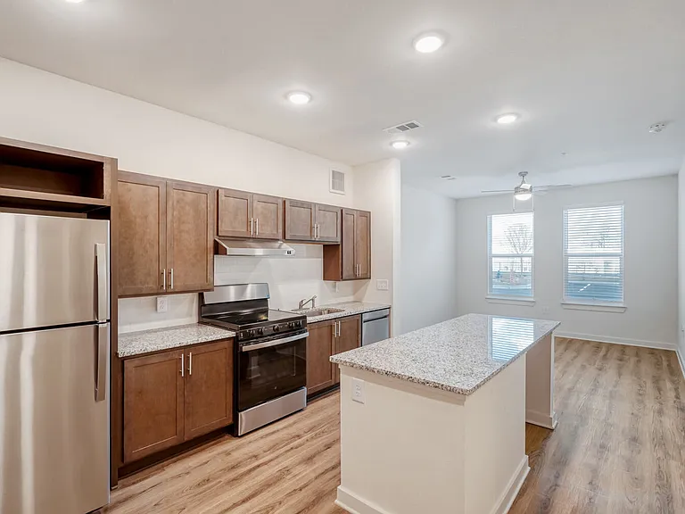 Unit Kitchen with Living Room in the Background