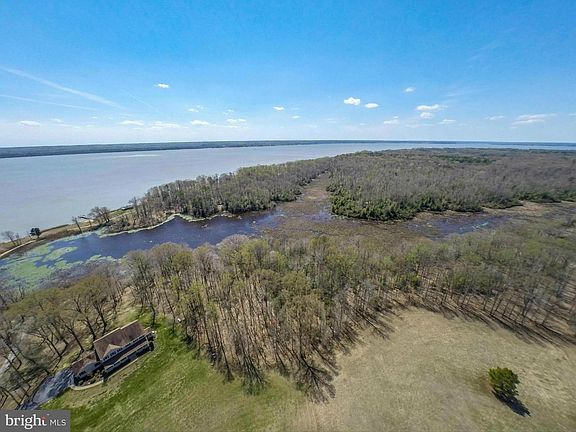 Aerial shows the main house, marsh, southwest views to Virginia.