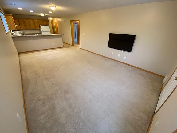 Large open-plan living / dining with bar