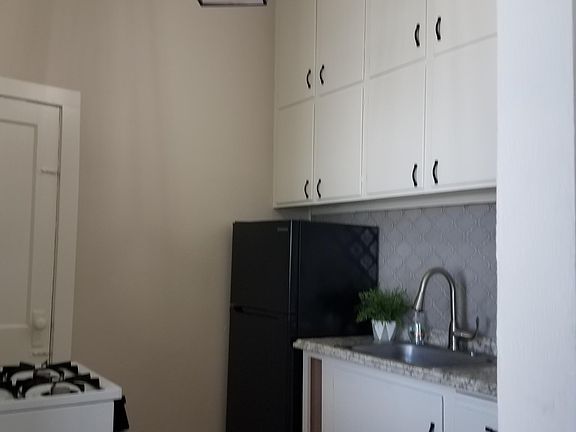 Kitchen with lots of cabinets and room for small table