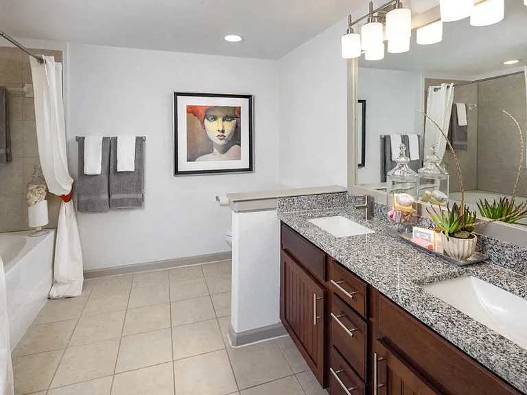 Modern bathrooms include double vanities and soaking tubs