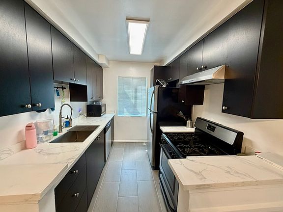 LARGE REMODELED KITCHEN WITH STAINLESS STEEL APPLIANCES