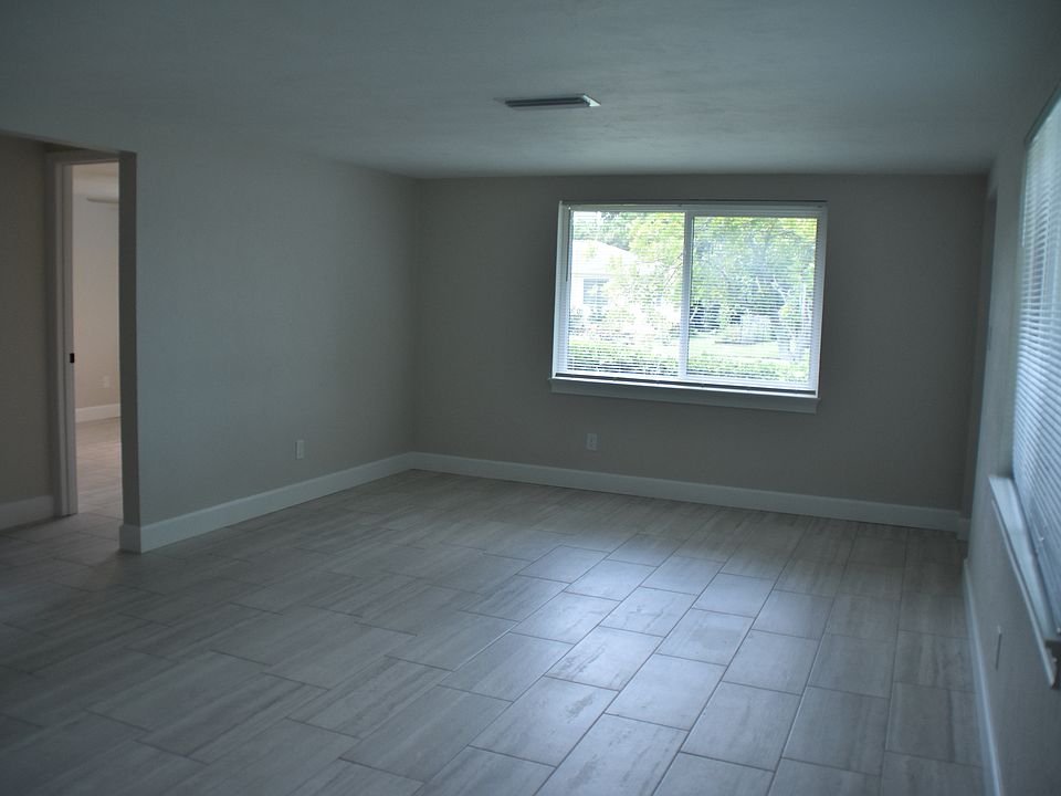 Living room area, window is the front of the unit. front door is on the right, the hallway is on the left to bedrooms and bathroom