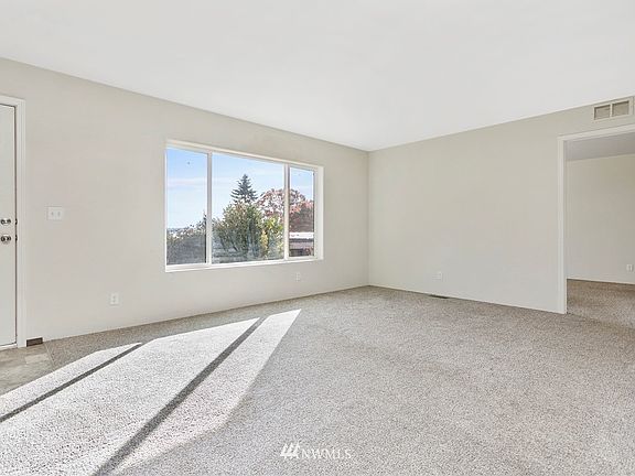 Big beautiful picture window w/ peek-a-boo views of the water.