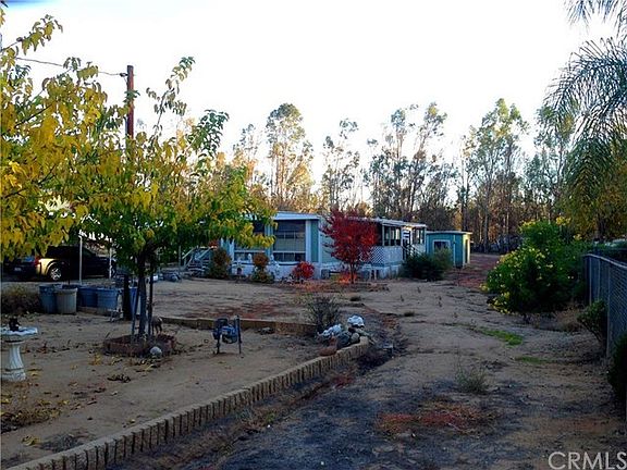 85 x 307.5 Foot Rectangular flat lot, fully fenced and double gated with circular pull through drive.