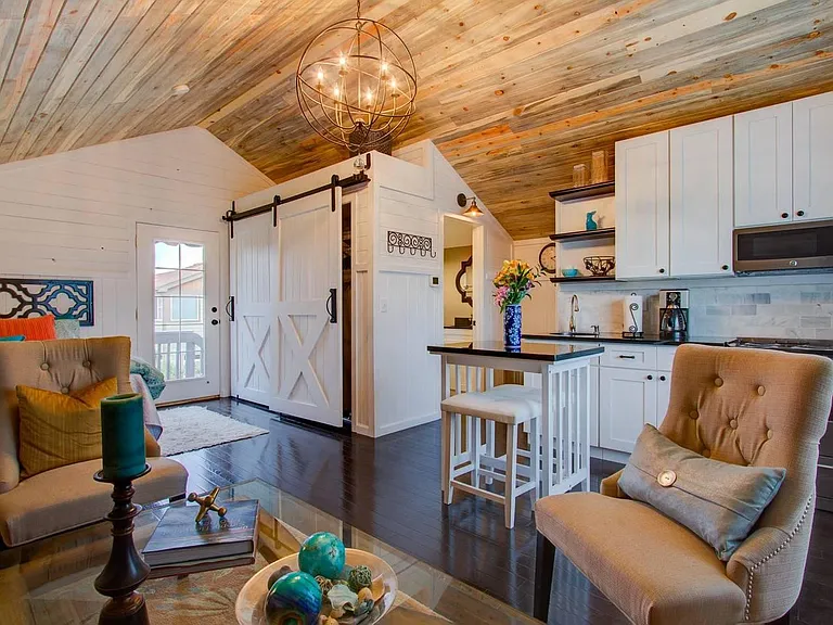 Comfy living space, lives large with vaulted ceiling and lots of sunlight.