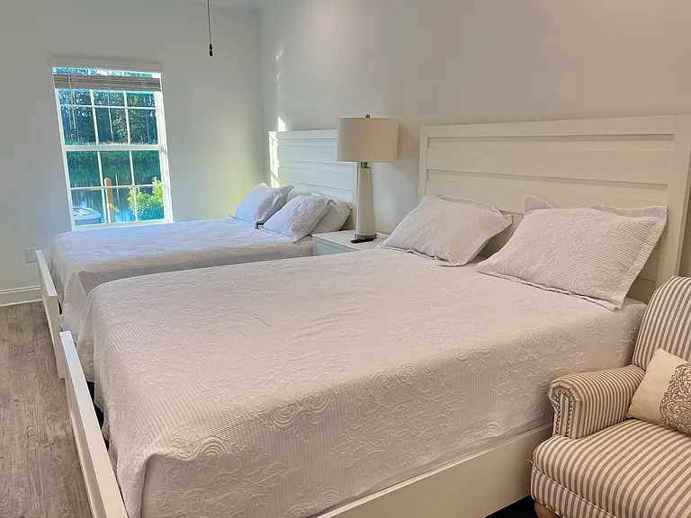 One of the bedrooms with separate door opening to the lake with lake view.