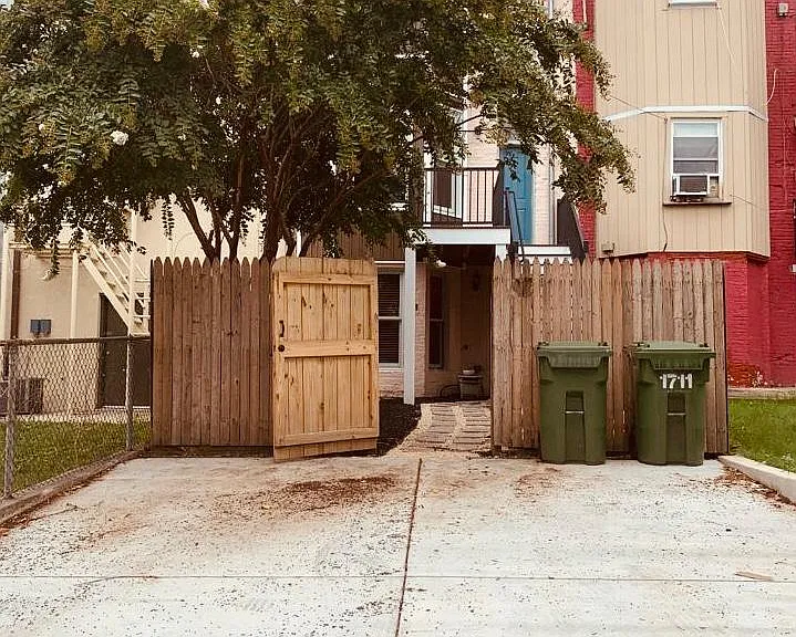 Rear parking pad and rear gated entrance