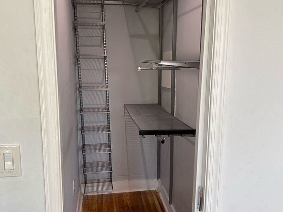 Upstairs master bedroom: Walk in closet with storage and shelving