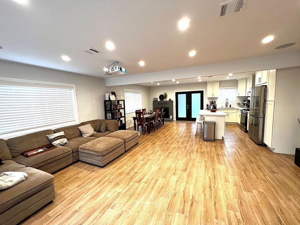 Living Room: Wood tile floors, new paint, recessed lighting, sound system