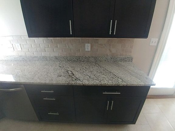 New granite, cabinets,and tile