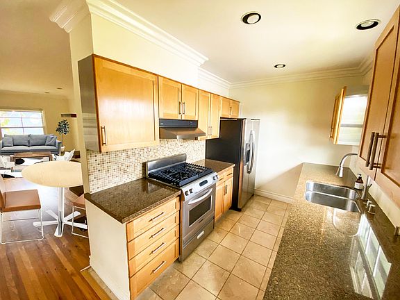 kitchen with stainless french door refrigerator and stainless dishwasher