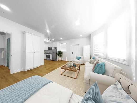 Deluxe Studio with bay window and patio or hall entrance (staged furniture not included)
