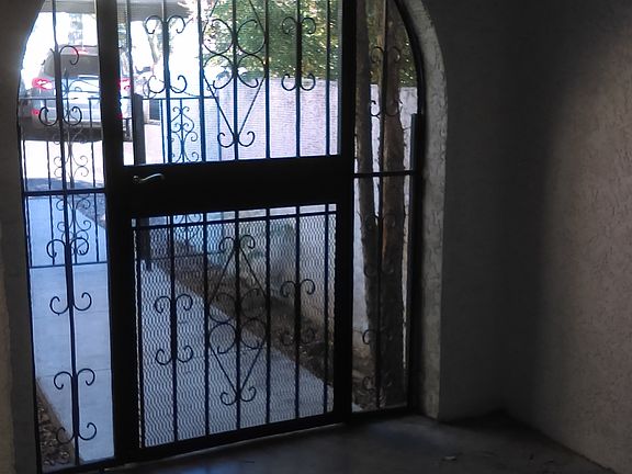 Inside Locked Gated Atrium Entry to Home