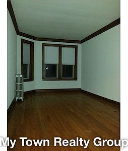 1st image of 3050 1/2 N Laramie Ave APT 1A