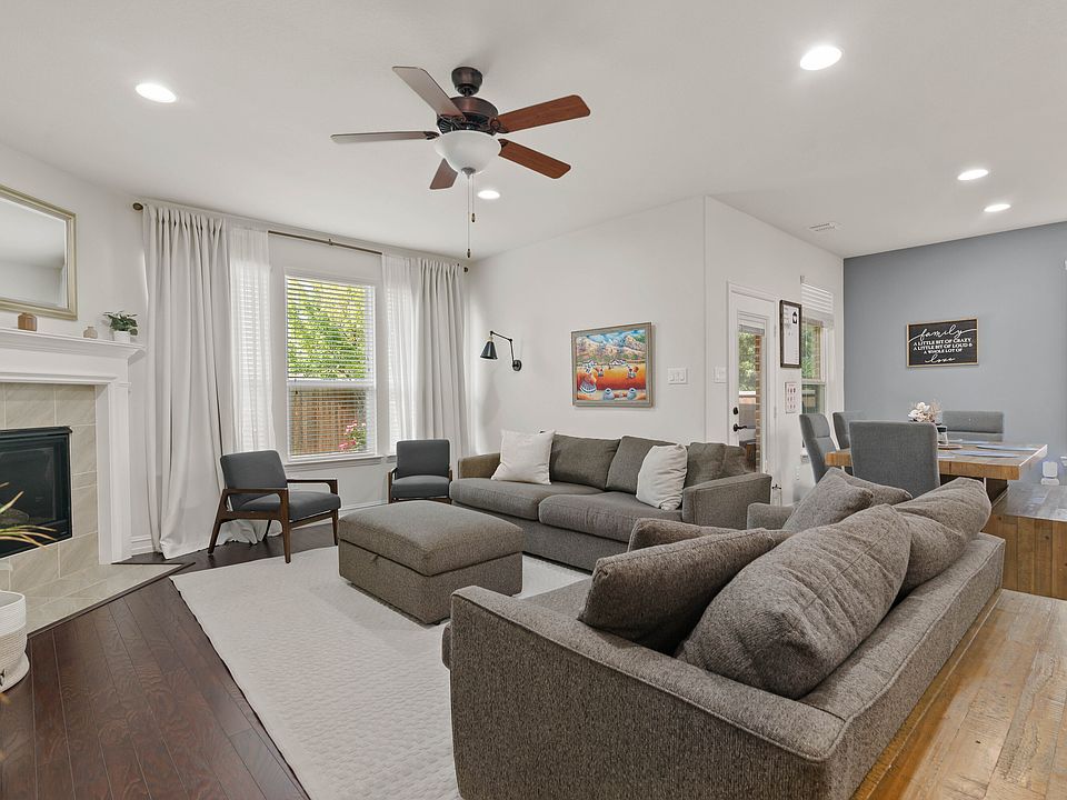 Living room with fireplace and back yard access
