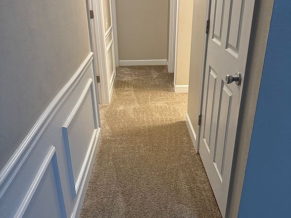 Hallway leading to bedrooms - brand new carpeting