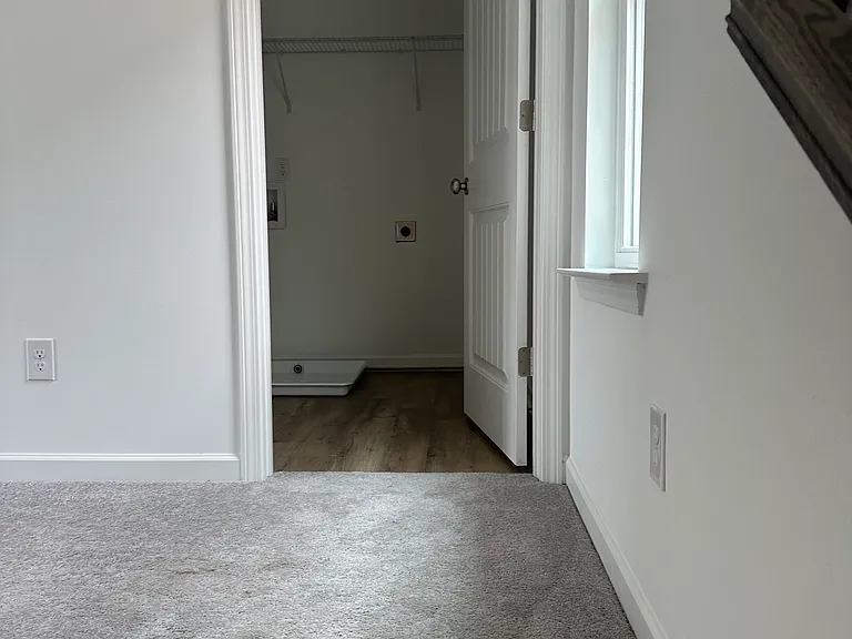 Top of stairway landing area and entrance into Utility Room
