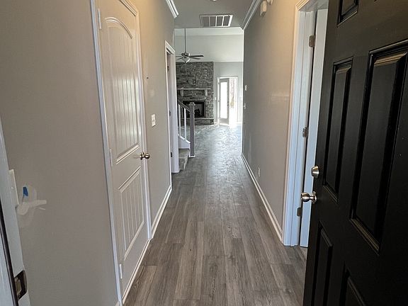 the foyer, great room, dining room, kitchen have laminate flooring, the house comes with 2 faux