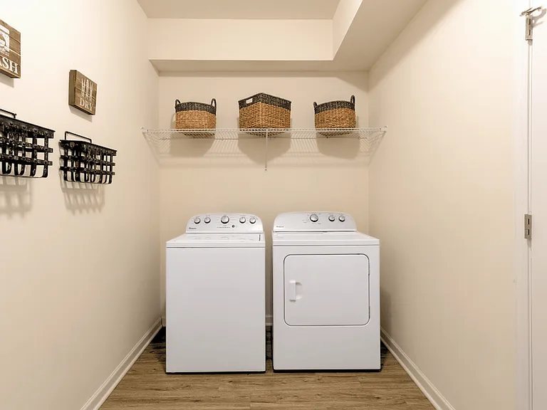 The convenience of an in-unit washer and dryer for a comfortable and stylish living experience.