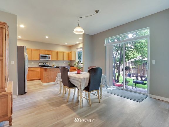 Nook area , new kitchen, slider to your beautiful backyard.