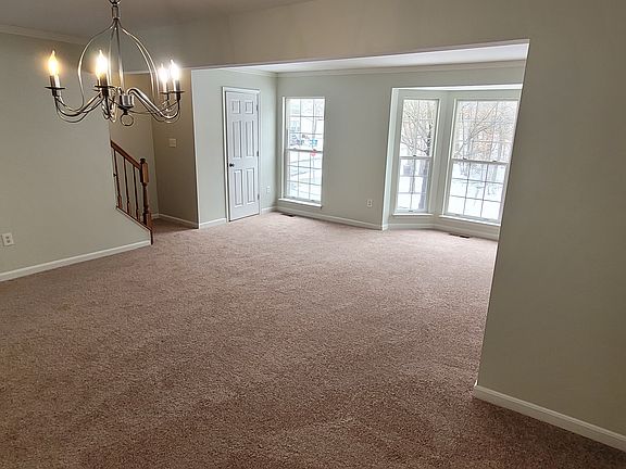 dining room/ living room/ door to half bath