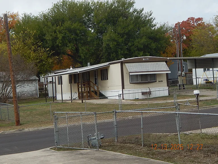 Taken from across the road - shows the large size of fenced lot.